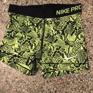 Green and black Nike pros